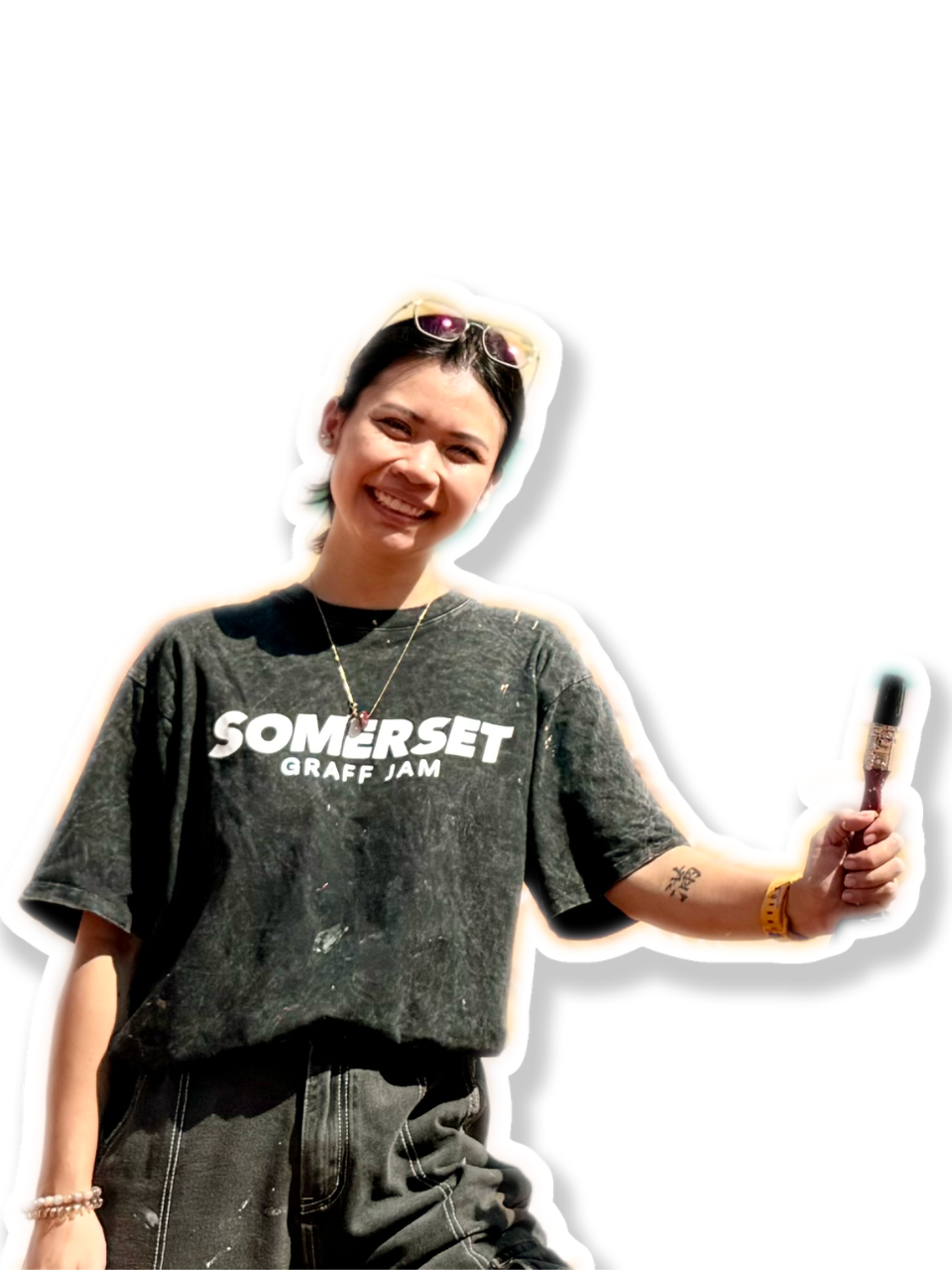 Eunice Hannah Lim, holding a paintbrush